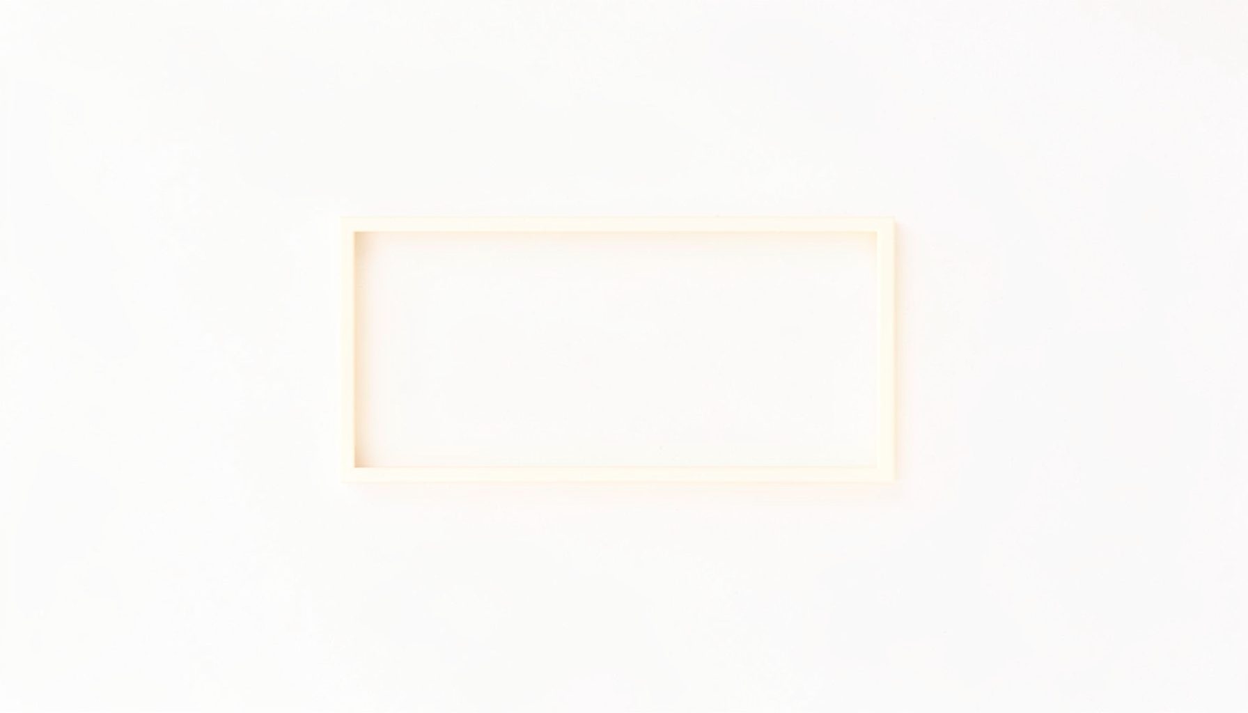 A simple rectangular placeholder mark in cream tones, representing an institutional affiliation